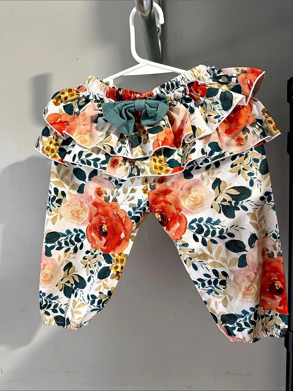 Adorable, Festive Baby “Pixie”  Pants in White & Orange floral